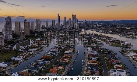 Gold Coast, Australia - May 5 2019: Aerial Reverse Sunset Views Looking Down The Canals Of Macintosh