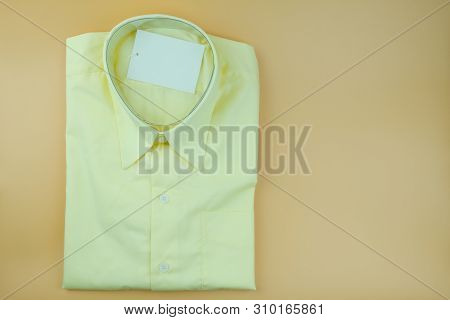 New Nice Yellow Shirt For Male On Yelloow Background