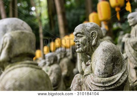 groups of buddhist arhat stone statue in the garden