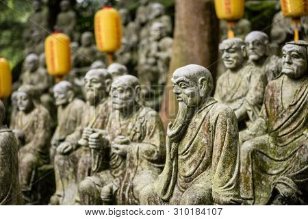 groups of buddhist arhat stone statue in the garden