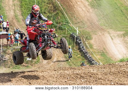 Brezova Nad Svitavou, Czech Republic - June 15, 2019: Closeup Dynamic Shot Of Quad Rider Jumping In 