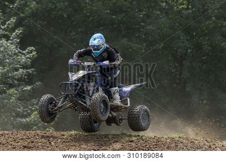 Brezova Nad Svitavou, Czech Republic - June 15, 2019:  Closeup Shot Of Quad Rider In Black Jumping I