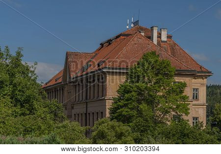 Building Of Old Big School In Pecka Town In Summer Hot Day