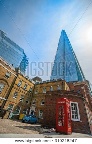 London England _ July 16 2013; Ultra-modern The Shard Landmark Skyscraper Building Surrounded By Low