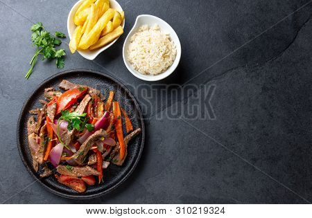 Peruvian Dish Lomo Saltado - Beef Tenderloin With Purple Onion, Yellow Chili, Tomatoes Served Onvbla