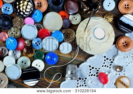 Buttons, Needle, Thimble, Thread And Pattern - Background For The Design And Creativity Of The Tailo