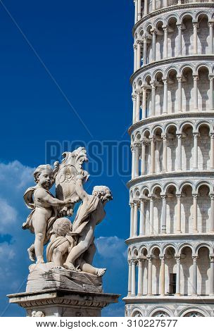 Fontana Dei Putti And The Leaning Tower Of Pisa
