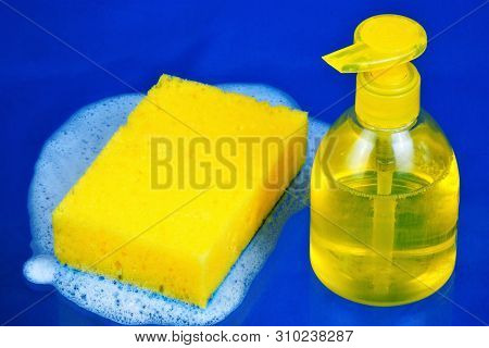 Soap Liquid In The Dispenser And Sponge In Soapy Foam, Cleaning. Soap With Water Is Effective For Wa