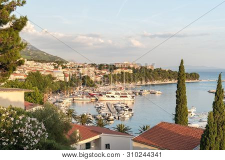 Beautiful Sunset In Baska Voda Town With Adriatic Sea And Boats, Croatia