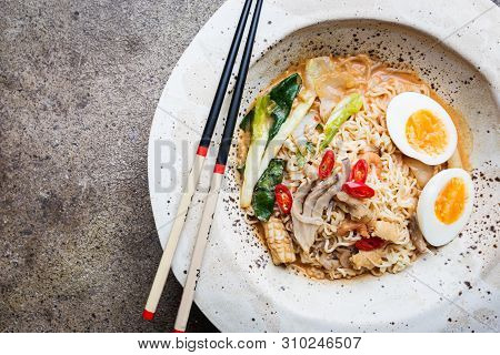 Japanese Ramen Noodle With Chicken, Shiitake Mushroms And Egg In White Bowl, Top View