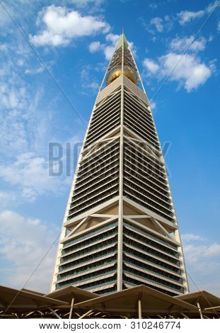 RIYADH - AUGUST 22: Sunset light at Al Faisaliah tower facade on August 22, 2016 in Riyadh, Saudi Arabia. Al Faisaliah towers is a luxury hotel and the most distinctive skyscraper in Saudi Arabia