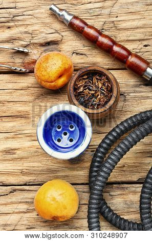 Smoking Arab Hookah With Apricots