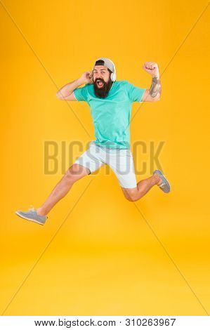 Energy Of Rhythm. Music Fan. Man Listen Music Wireless Headphones In Motion. Bearded Guy Enjoy Music