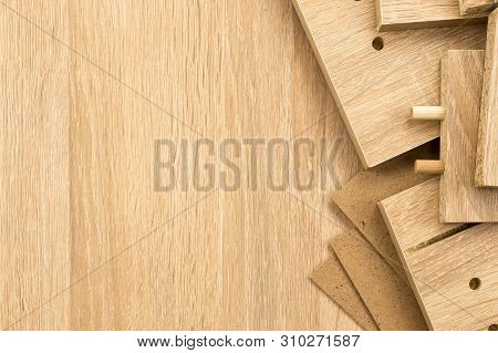 High Angle Close Up Of Unfinished Wood Planks With Pegs And Holes - Background Of Disassembled Woode