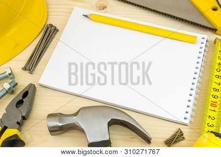 Project Planning In Carpentry And Woodwork Industry. Notebook And Assorted Woodwork Tools On Pinewoo