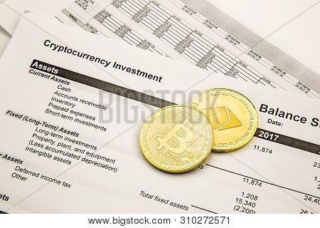 Still Life Of Cryptocurrency Investment. Bitcoin And Ethereum Souvenir Coins Layed Out On An Investm