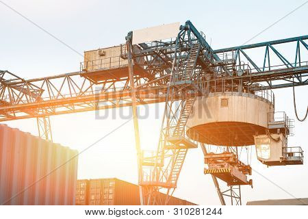 Large Industrial Port Crane Unloads Cargo Containers