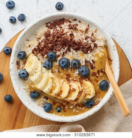 Oatmeal Rustic Porridge With Blueberry, Bilberry, Blackberry, Banana, Chocolate And Nut Honey Pasta,