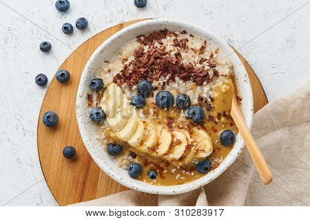 Oatmeal Rustic Porridge With Blueberry, Bilberry, Blackberry, Banana, Chocolate And Nut Honey Pasta,
