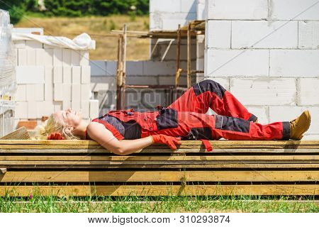 Woman Taking Break On Construction Site