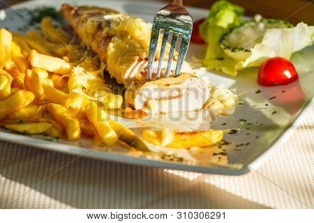 Traditional Montenegrin Meat Negush Steak On A White Plate In A Restaurant.