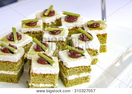 Green Tea Cake With Red Bean Sauce On Top Ready To Serve.