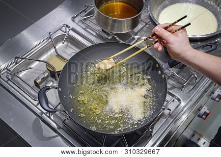 Fried Salmon Piece In The Oil Pan.