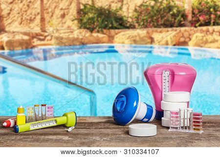 Equipment With Chemical Cleaning Products And Tools For The Maintenance Of The Swimming Pool.