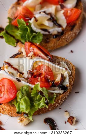 Bruschetta With Tomatoes, Lettuce, Camambert, Balsamic Vinegar