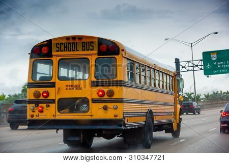 School Bus On The Highway In Miami On A Cloudy Day, Usa