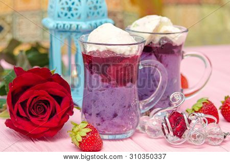 Mahalabia - Traditional Middle Eastern Dessert. Creamy Dessert With Berries And Yogurt Cream. Arabic