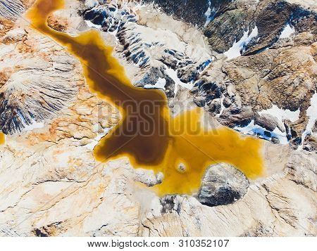 Clay Open Quarry Mars Landscape With Orange Water. Abandoned Rock Texture Old Porcelain Pit Mine In 