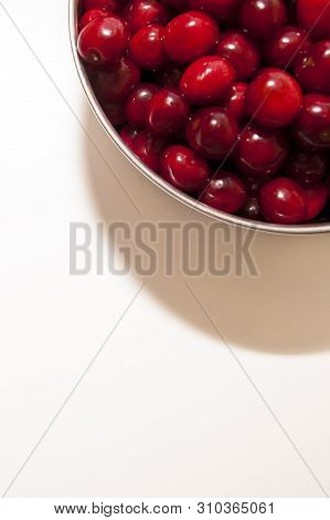 Bowl Of Cherries On A White Background. Red Cherries. Bowl Placed On Top Lright Corner Of The Frame