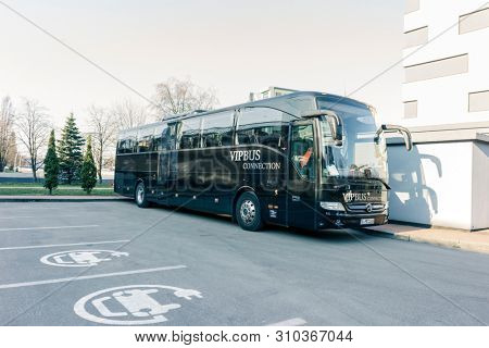 RUSSIA, KALININGRAD KOENIGSBERG -APRIL 13, 2019 : Modern Black Passenger Bus on the Parking Lot