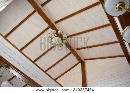 Ceiling And Rafters In The House Made Of Glued Timber.