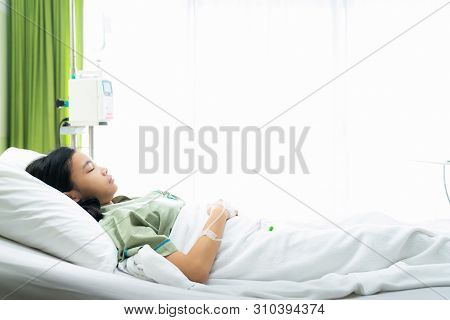 Asian Lady Sleep And Patient In Hospital With Iv Solution, This Immage Can Use For Flu, Sick, Health