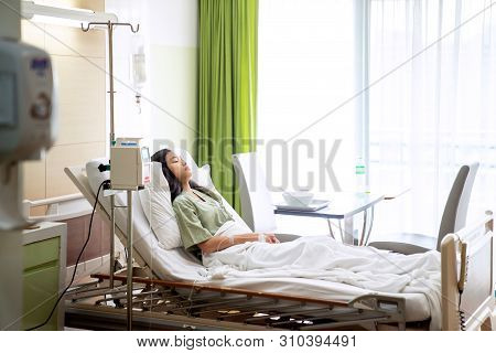 Asian Lady Sleep And Patient In Hospital With Iv Solution, This Immage Can Use For Flu, Sick, Health