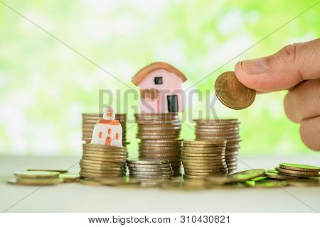 While Having A Woman's Hand Holding Gold Coin Concepts Of Dreams And Future.