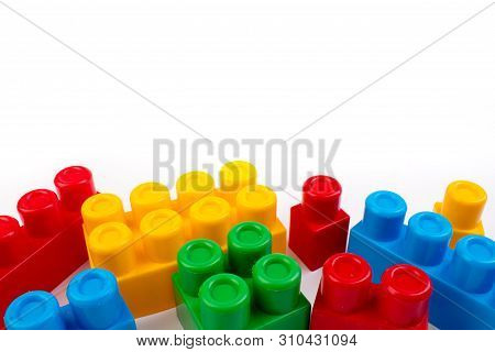 Lot Of Colorful Rainbow Toy Bricks Background. Educational Toy, Constructor For Children Isolated On