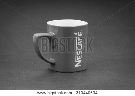 Kuala Lumpur, Malaysia - July 03, 2019; Promotional Red Nescafe Mug On Black And White.  Selective F
