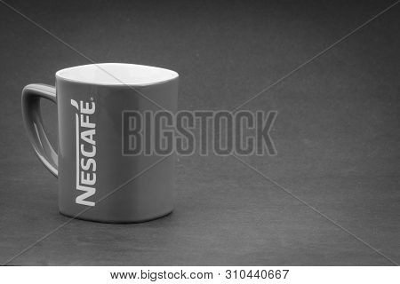 Kuala Lumpur, Malaysia - July 03, 2019; Promotional Red Nescafe Mug On Black And White.  Selective F