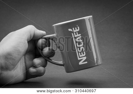 Kuala Lumpur, Malaysia - July 03, 2019; Promotional Red Nescafe Mug On Black And White.  Selective F