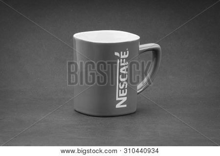 Kuala Lumpur, Malaysia - July 03, 2019; Promotional Red Nescafe Mug On Black And White.  Selective F