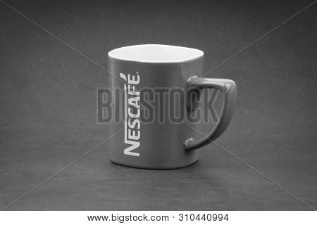 Kuala Lumpur, Malaysia - July 03, 2019; Promotional Red Nescafe Mug On Black And White.  Selective F
