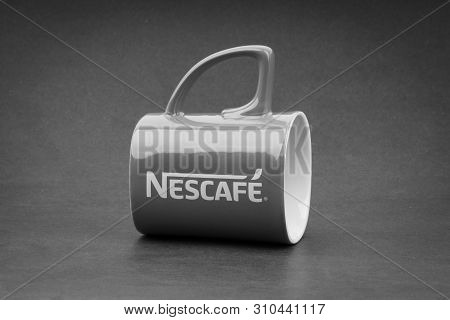 Kuala Lumpur, Malaysia - July 03, 2019; Promotional Red Nescafe Mug On Black And White.  Selective F