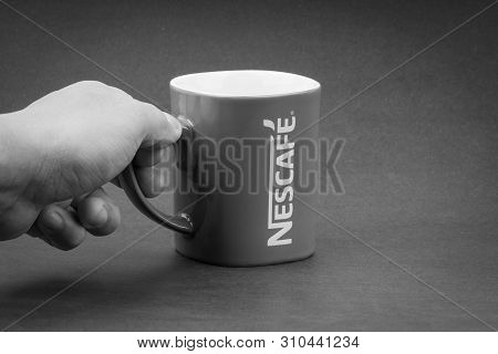 Kuala Lumpur, Malaysia - July 03, 2019; Promotional Red Nescafe Mug On Black And White.  Selective F