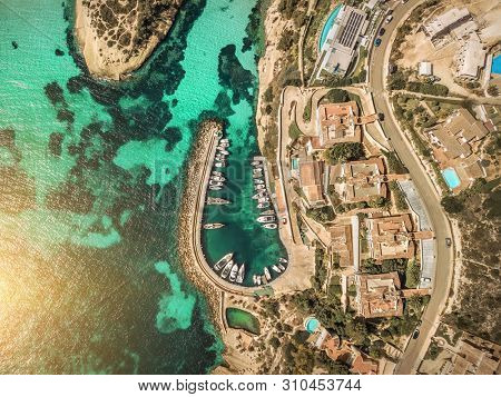 Beautiful birdeye view on the sea coastline with pier and yakhts at sunny day. Travell, jorney,islands, Seascape, freedom, holidays concept.