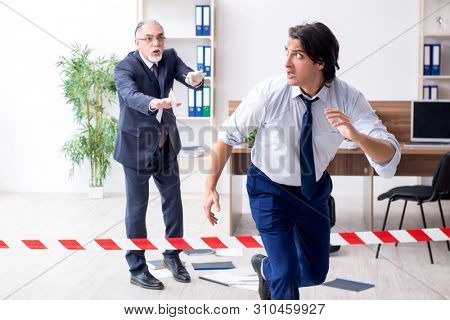 Forensic investigator investigating theft in the office