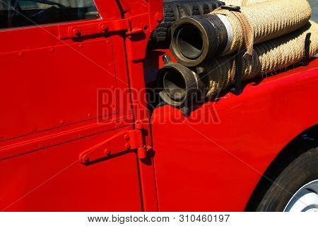 Detail Of Old Vintage Firetruck With Fire Hose