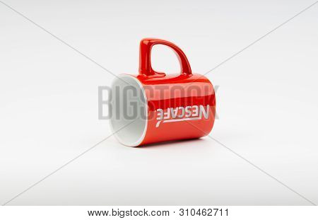 Kuala Lumpur, Malaysia - July 03, 2019:  Promotional Red Nescafe Mug On White Background. Selective 